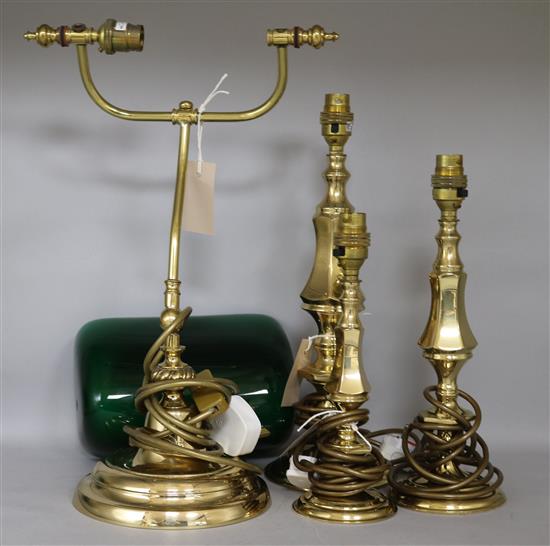 A modern brass table lamp, a similar pair of table lamps (all with shades) and a brass students lamp